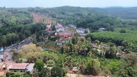 aerial view of a peaceful village nestled in lush green hills