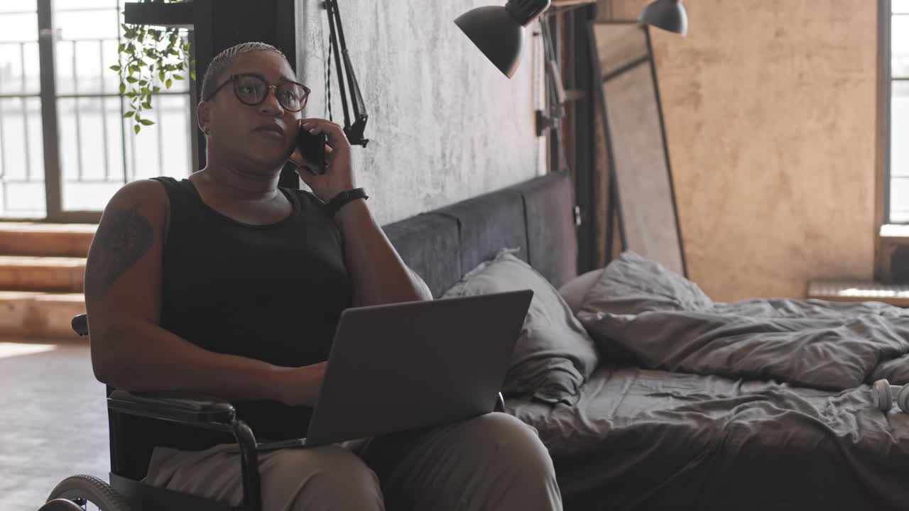 Female Freelancer in Wheelchair in Bedroom