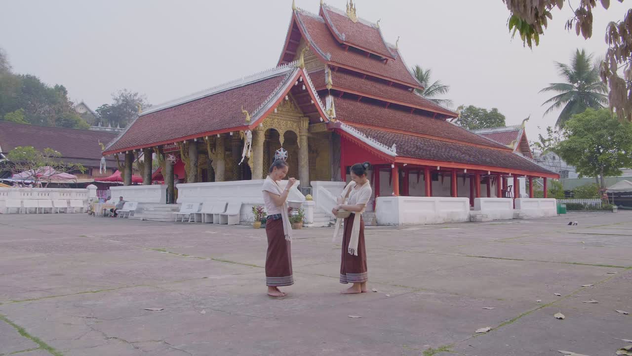 Beautiful Girls Hold A Bowl With Water Enjoying Splashing Water On Songkran Day, Slow Motion