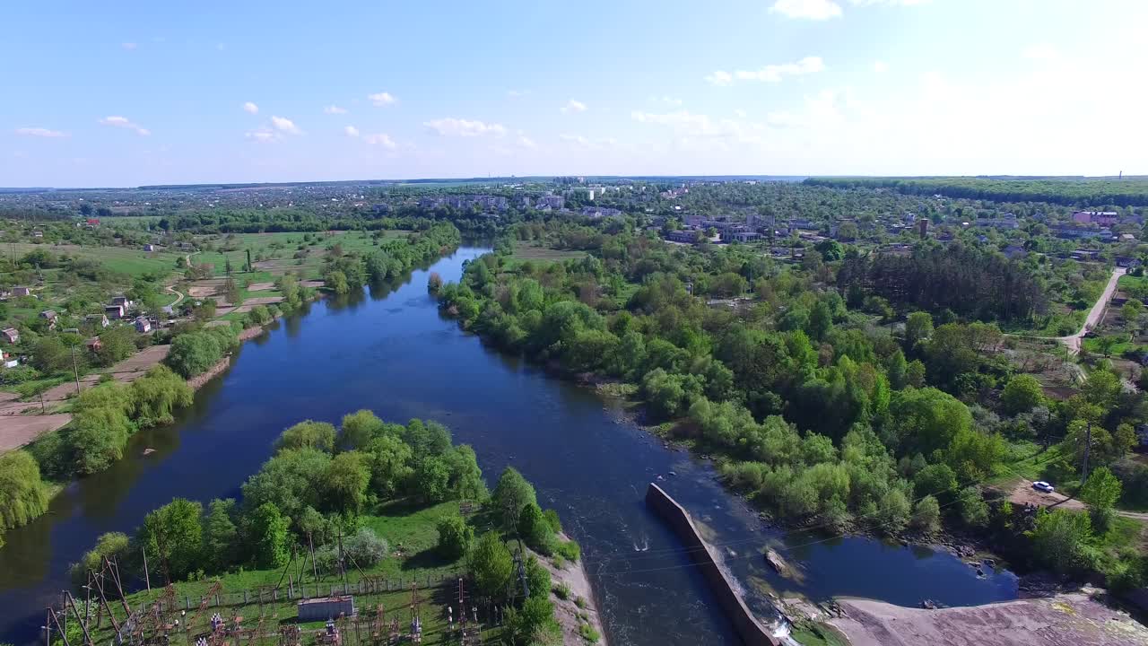 Old dam in countryside. Aerial view of dam on the big river