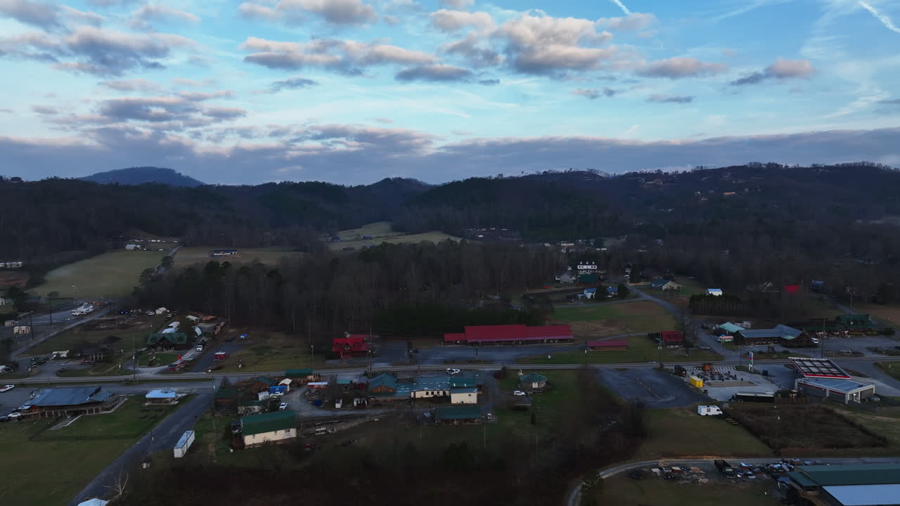 Early morning clouds and a blue sky create a tranquil drone flight around the Wears Valley in the Great Smoky Mountains of Appalachia