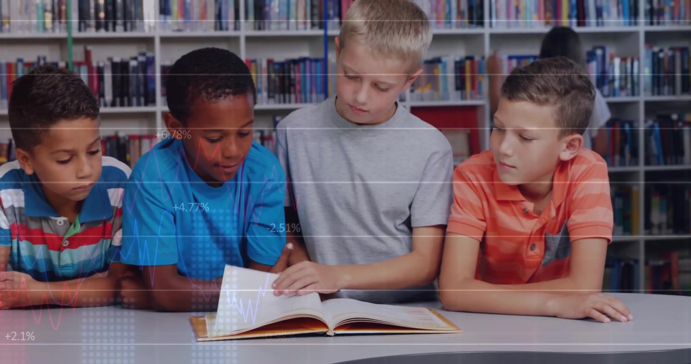 Boy in blue T-shirt pointing at text and starting page flipping, others following for library study