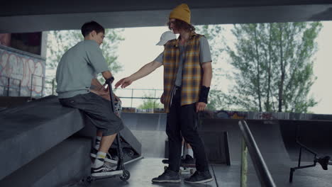 young people spending time together outdoors. hipster friends socializing.