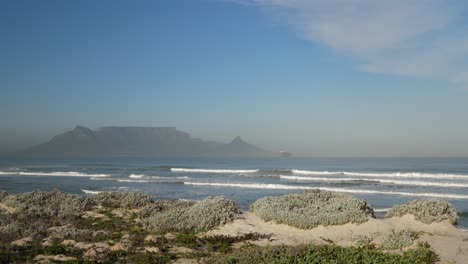 table mountain and lions head seen from cape town's blouberg beach