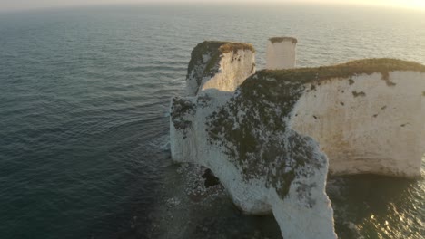 dramatic coastal cliffs at sunrise/sunset