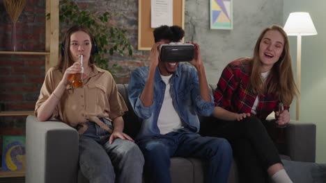 african-american man with vr glasses and women watch soccer