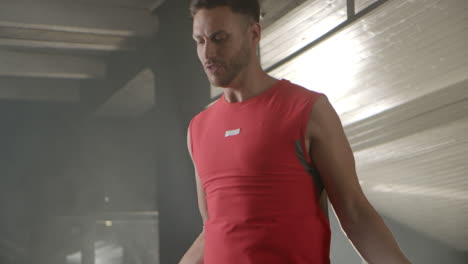 man in red tank top in gym