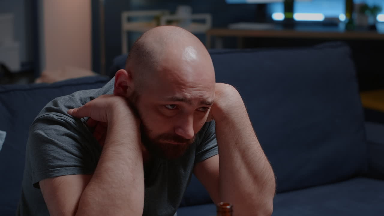 Close up of psychotic alone frustrated man staring into space with tears