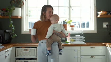 mother with baby in kitchen