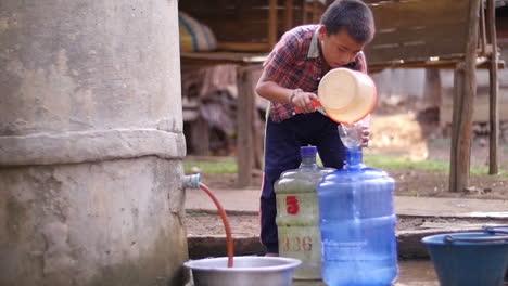child collecting water