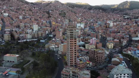 Aerial-orbits-skyscraper-under-construction-on-La-Paz-Bolivia-skyline