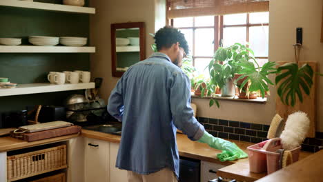 a man cleans the kitchen counter