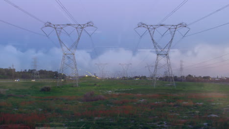 animation of data processing over landscape with electricity pylons