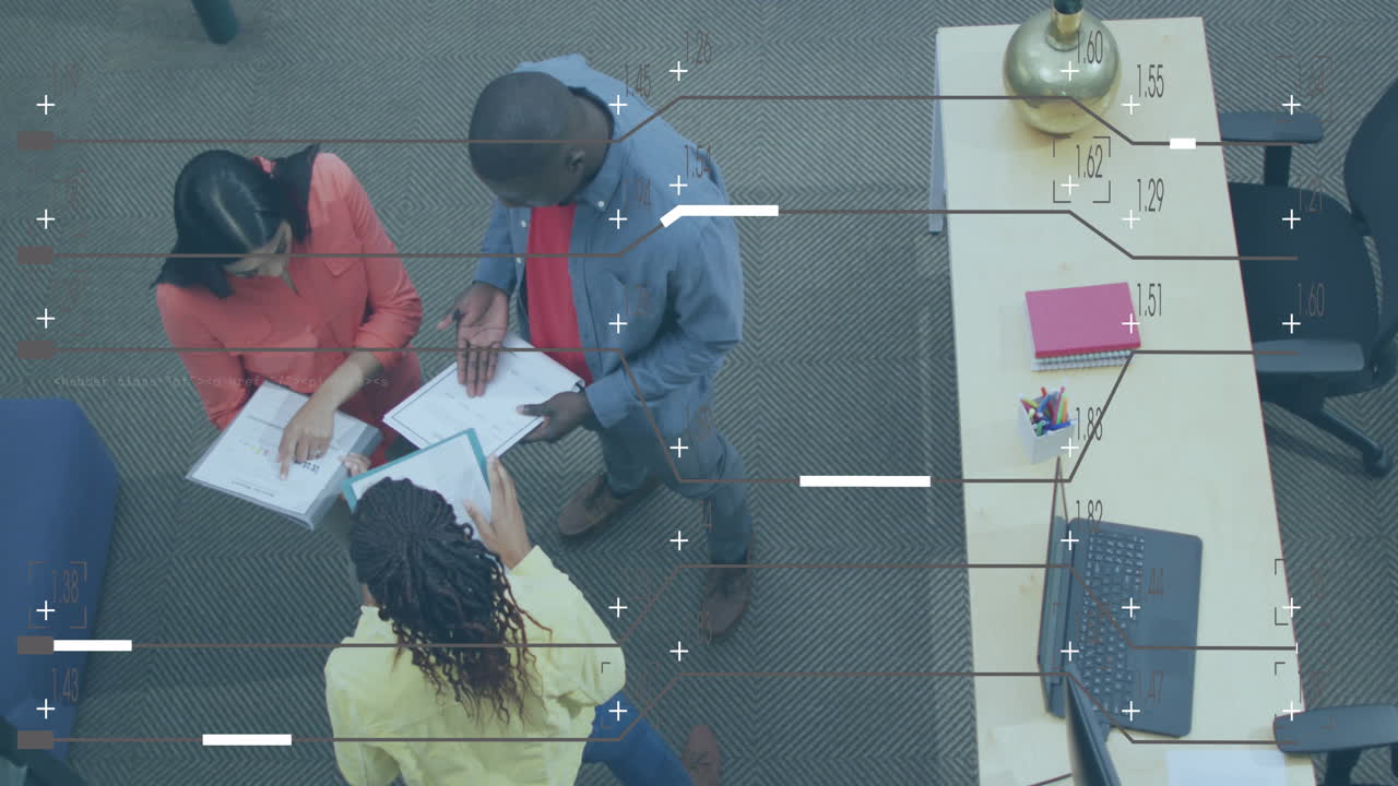 Animation of computer language and lines, high angle view of diverse coworkers discussing reports