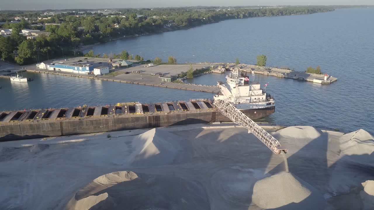 White Fine Sand Coming Out From A Dredging Vessel At The Port In Kingsville, Ontario, Canada - Aerial Shot