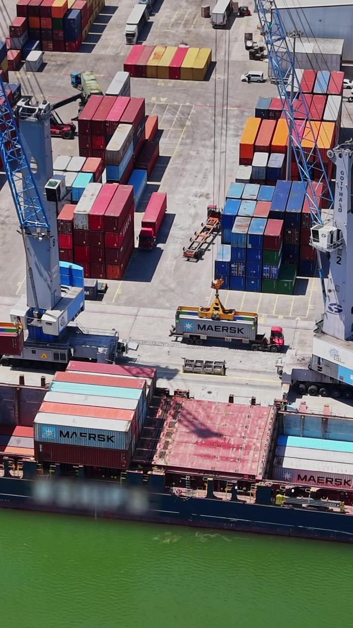 Cargo ship at port loading containers in the daytime