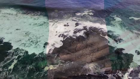 digital composition of waving nigeria flag against aerial view of waves in the sea