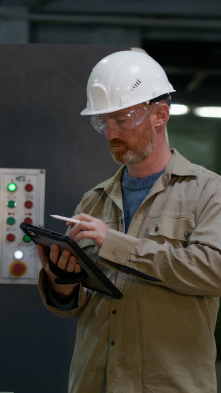 Industrial Worker Using Digital Tablet
