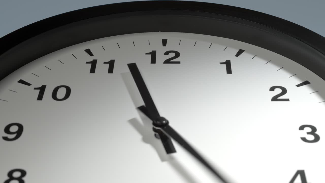 Clock Face on Light Blue Wall in Time Lapse