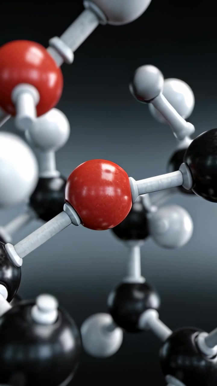 Vertical video: Pulling camera back from closeup, revealing molecule to show red nodes in studio