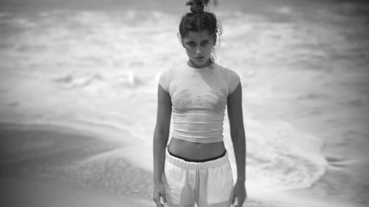 Black and white portraits of a woman on the beach