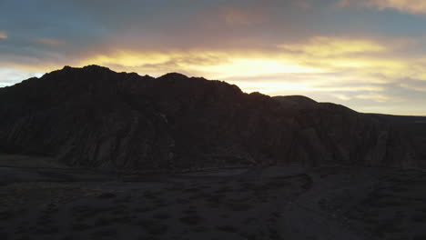 Mountain-silhouette-with-the-sun-behind,-creating-a-stunning-play-of-light-and-shadows,-highlighting-the-natural-beauty-of-the-landscape