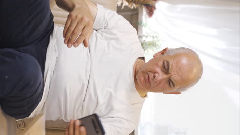 Vertical video of Alzheimer&#039;s disease old man.