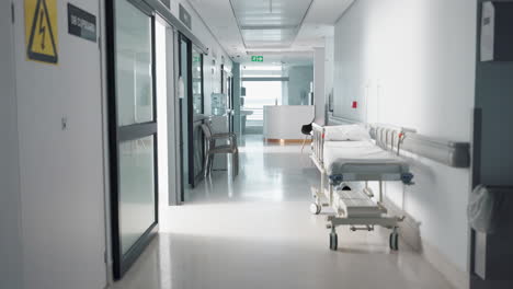 healthcare, hospital and empty corridor with bed