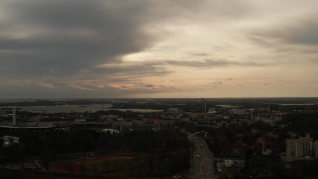 Aerial shot a nordic cityscape with a cloudy gray sky during cold evening