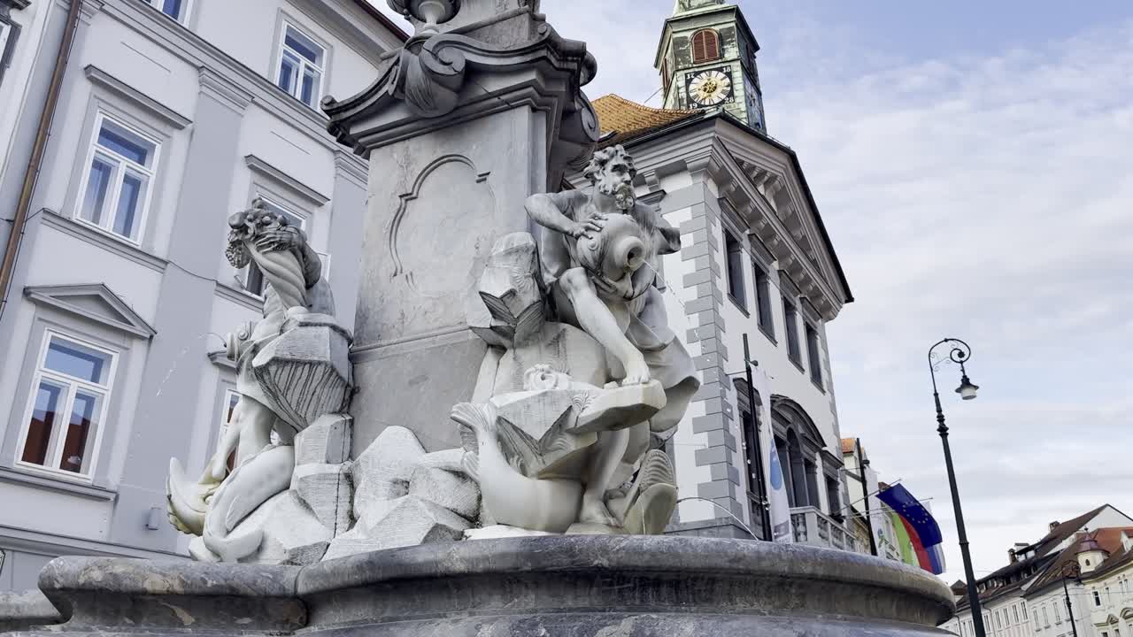 Beautiful marble Robba Fountain in Ljubljana Old Town, with City Hall in background - Slovenia