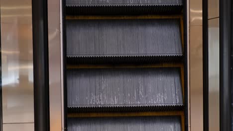 Escalator-stairs-going-up-with-no-people,-Bangkok,-Thailand