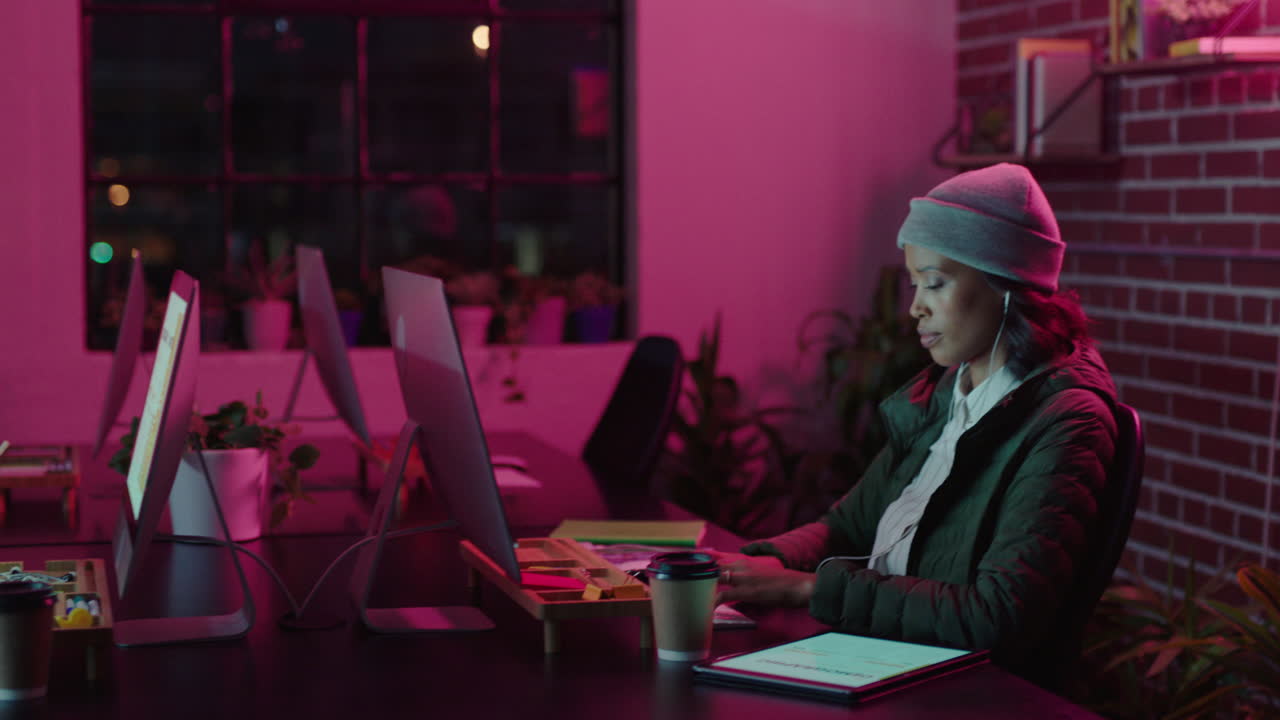 business people working late using computer technology creative team brainstorming project strategy planning successful deadline in modern office at night