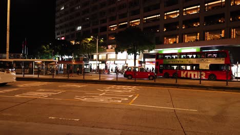 buses and cars moving on city street