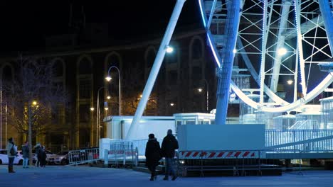 people walking near a panoramic wheel