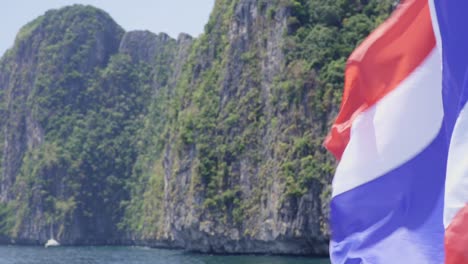 close up shot of a thailand national flag at a boat at phi phi island