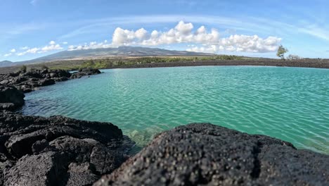 turquoise waters and lava rocks