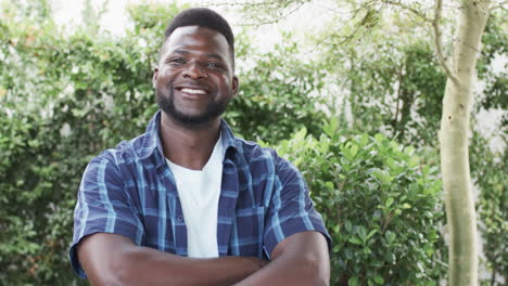 African-American-man-smiles-confidently-outdoors-with-copy-space