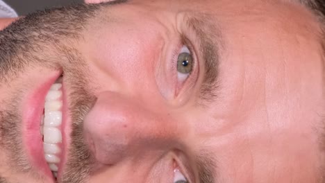 closeup portrait of a handsome brutal man with a beard looking at the camera and smiling closeup portrait of a handsome brutal man with a beard looking at the camera and smiling happy person