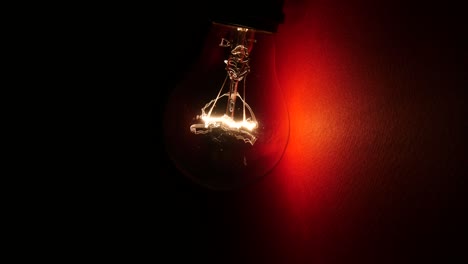 light bulb at red wall