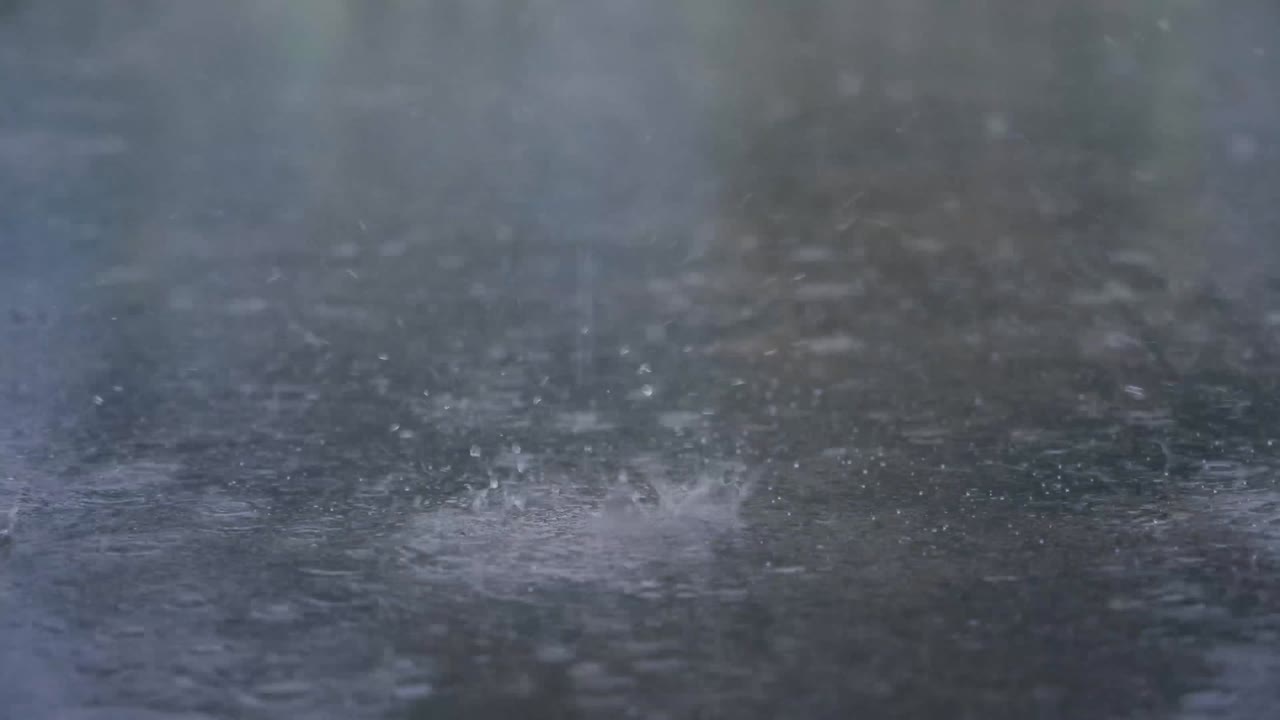 The rain is falling on the ground.