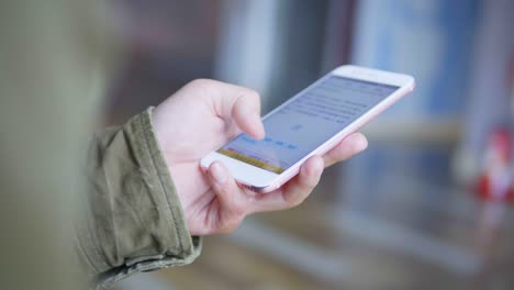 man using smartphone on metro station