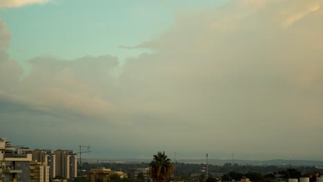 a beautiful day to night time lapse of a sunset above the city, was shot from the roof, israel tel aviv, middle east, colorful surfing clouds, golden hour, cityscape, sony 4k video