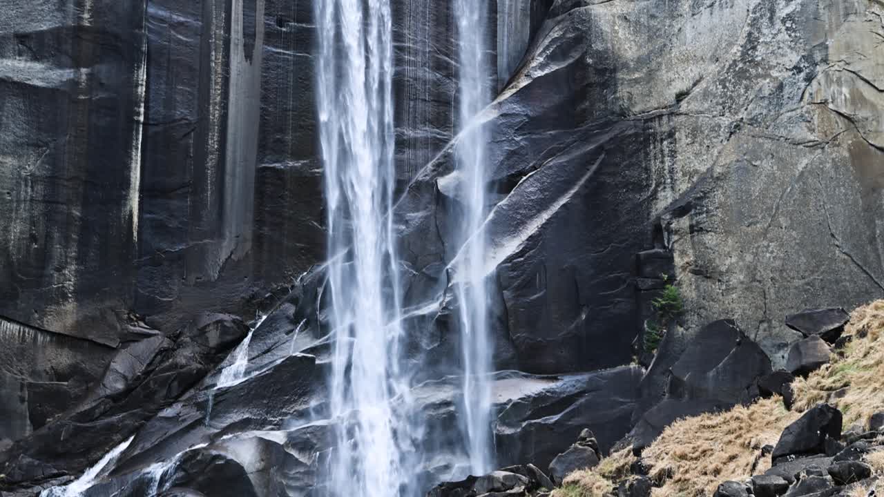 Young woman taking in the view at Vernal Falls in Yosemite National Park FOCUS SHIFT PAN UP