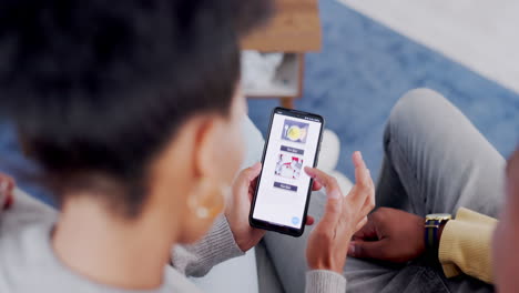 Overhead,-phone-and-a-customer-couple-on-a-sofa