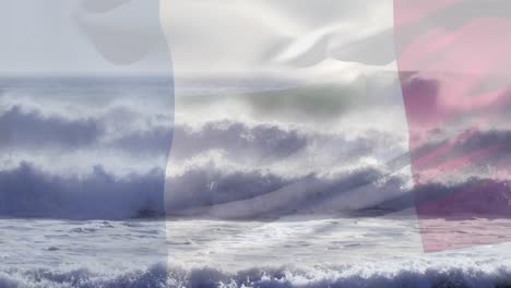 composición digital de agitar la bandera de francia contra las olas en el mar
