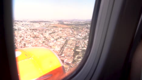 airplane window view of sao paulo city, brazil