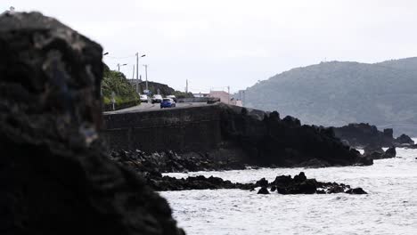 waves on the rocky shore at angra bay in são mateus da calheta, terceira island, portugal