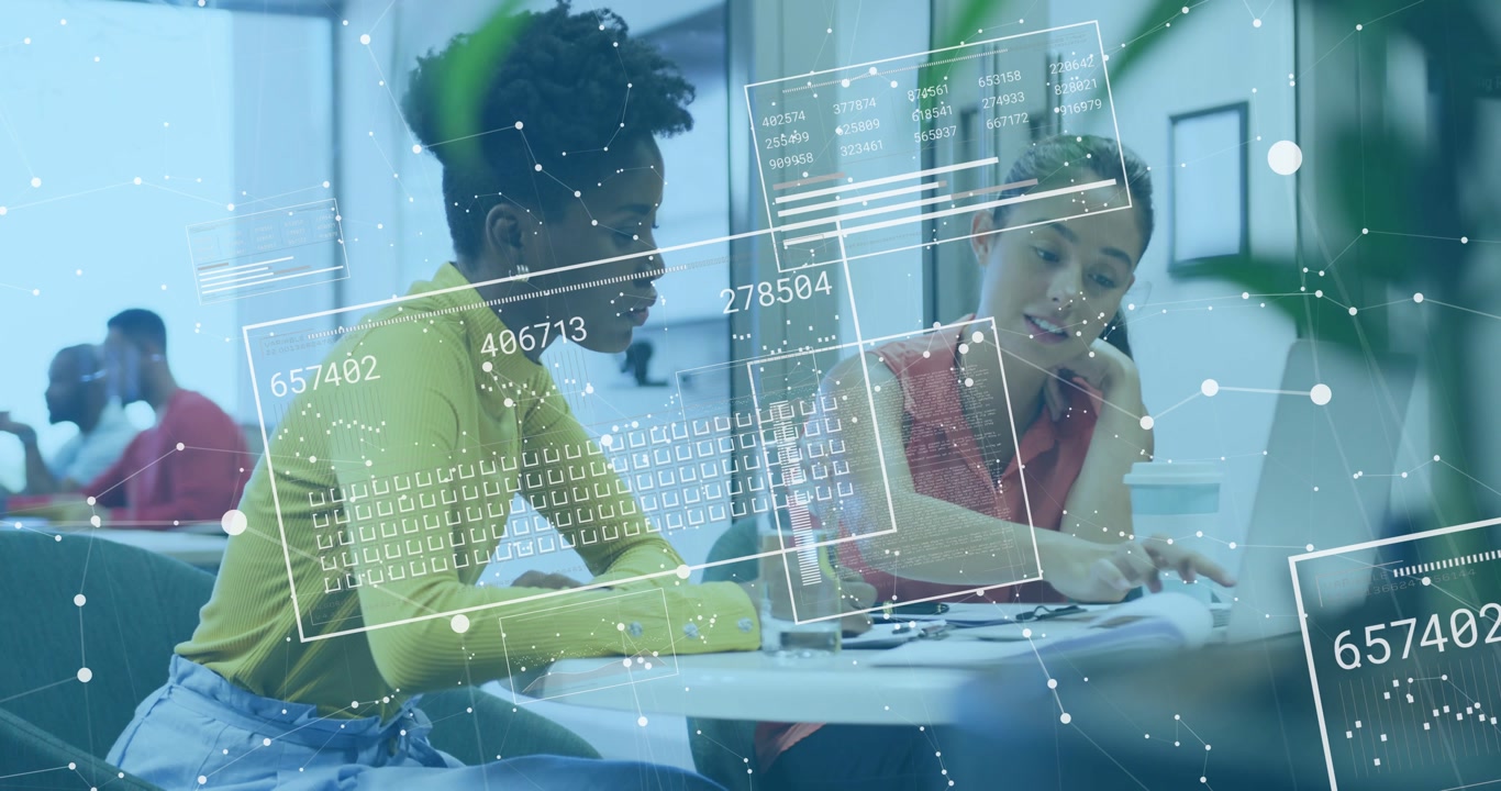 Women collaborating in office following drifting digital overlays and analyzing report details