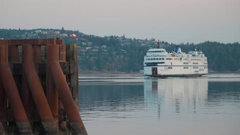 long shot of a ferry approaching ferry terminal