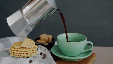 pouring espresso coffee over waffles